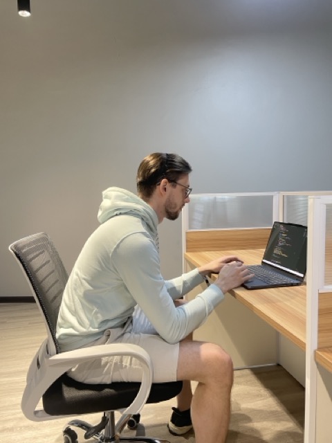 Person caught slouching with terrible posture at desk