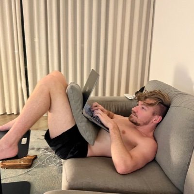 Person slouching while working with forward head posture